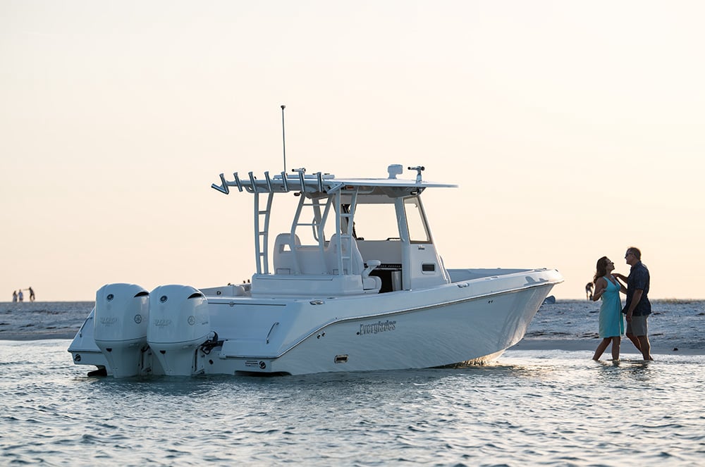 Everglades 335CC anchored in the Arabian Gulf at sunset with friends fishing and relaxing on the bow.